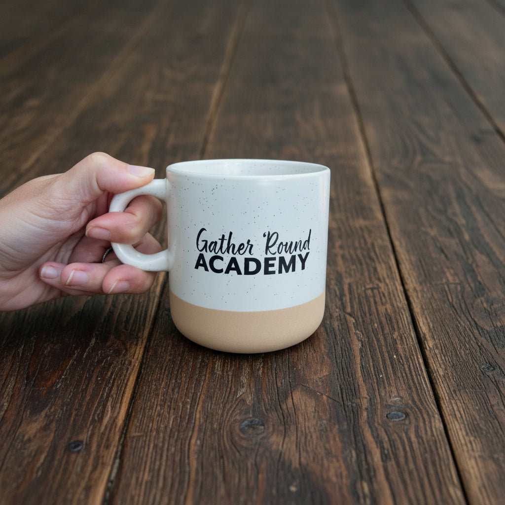 Gather 'Round Academy coffee cup on a wooden table