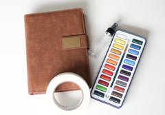 Ocean Life homeschool unit study watercolor kit with tape, paints, and a leather notebook