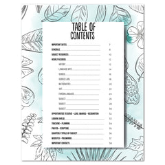 A printed table of contents sheet with black text on a white background, placed over a decorative floral backdrop with light blue and white botanical illustrations.