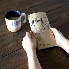 Advent calendar  with cup of coffee on a wooden table 